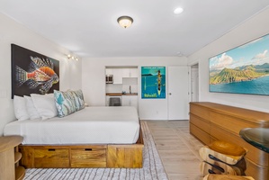 Thoughtfully designed suite with a queen bed, smart storage, and a full sleeper sofa in a den.