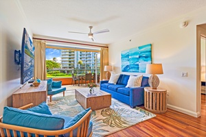 Comfortable living space at Honua Kai Konea 206 opens to a furnished lanai.