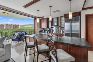 Cook with ease in your modern kitchen while soaking up stunning mountain views through floor-to-ceiling windows that frame the scenic landscape beyond.