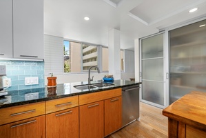 Ocean breeze fills this thoughtfully designed kitchen space with clean lines and natural light.