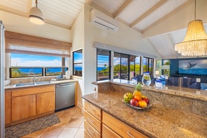 The fully equipped kitchen at Wailea Ekolu 1106 has ample counter space for meal prep.