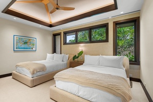 Guest Bedroom #3: Drift off in your tropical queen bedroom sanctuary, where plush beds and garden views create your perfect escape.
