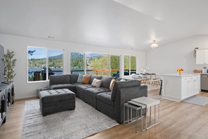 Enjoy quality time in the open-concept living area, where natural light and Big Lake vistas enhance every gathering.