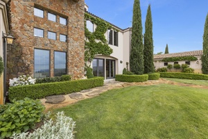 Front yard with beautiful landscaping and flower garden