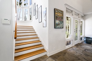 Interior staircase leads to upstairs bedrooms and the private media room.