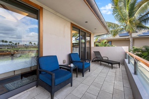 Relax on the upper lanai with mountain, golf, and palm-lined horizon views.