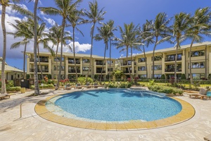 Inviting community pool surrounded by tropical gardens and ocean breezes.