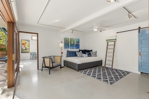 Bedroom 5 located off of the primary bedroom can be used as a second living room with two twin size day beds.