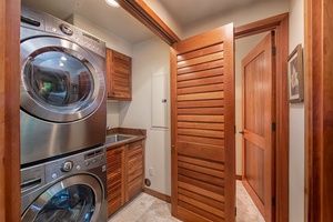 An in-unit laundry area for convenience.