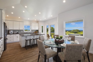 Open dining and living area offering a seamless flow for family gatherings and relaxation, complemented by stunning views.