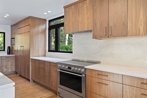 Enjoy easy meal prepping in the kitchen area with wide counter spaces and top tier appliances.