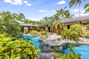 Relax poolside beside the pool and cascading spa waterfall, framed by panoramic ocean views.