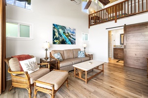 Relax in an airy living space, where natural light and open design invite you in.