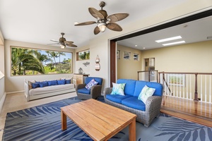 Bright and cheerful indoor lanai overlooking the tropical landscape.