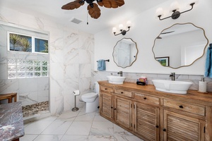 Primary ensuite awaits with warm touches and boho vibes