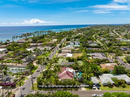 Aerial view showcasing the coastal neighborhood with views extending to the beautiful Hawaiian shoreline.