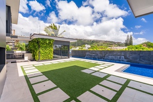 Step onto manicured greens with ocean-view edges—perfect for yoga at sunrise or a private moment under the palms.