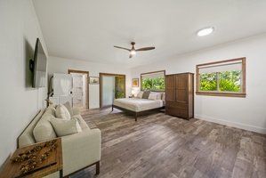 Detached studio suite with king bed, lounge seating, kitchenette, and private bath—a serene private escape.