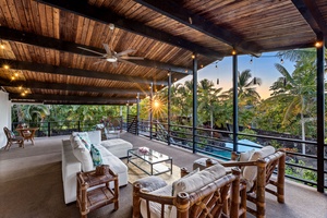 Chill out on your private covered terrace with comfortable seating, amazing views, and gentle evening lighting creating the perfect atmosphere.