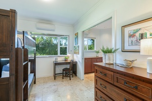 Bunk room with desk space and natural light — perfect for kids or additional guests.