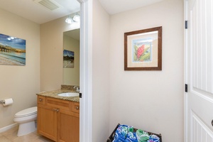 The downstairs half bath has single sink.