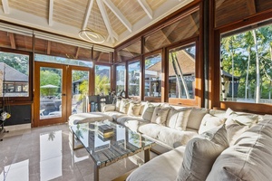 The second living area with cozy seating and access to a serene outdoor space.