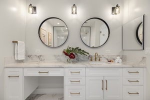 Private ensuite with dual vanities and modern finishes, perfect for a relaxing morning routine.