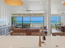 You'll love preparing meals in this stunning open kitchen while gazing at endless ocean views through floor-to-ceiling windows.