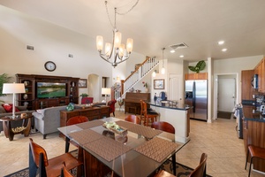 Gather around your spacious dining table while the chef prepares meals in your fully-equipped kitchen, with cozy living areas perfect for relaxing together.