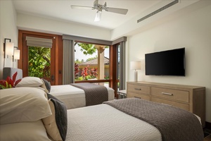 Alternate view of guest room with 2 beds, flatscreen television and patio.