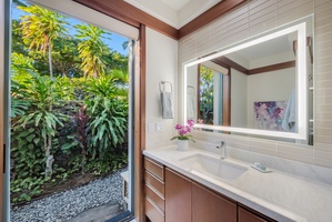 Guest Suite 2 ensuite bathroom offering plenty of counter space and natural light.