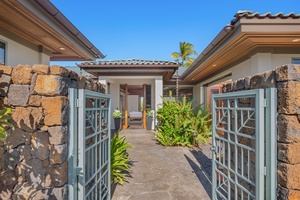 The gated entryway patio invites you to explore more of this exceptional estate.