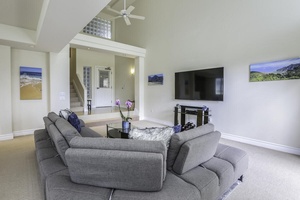 High ceilings with ceiling fans to circulate cool breezes or air conditioning in the spacious living room