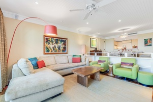 Bright and open living area with comfortable seating and island-style decor.