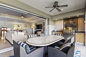 Wailea Hoolei 93-3 offers seamless indoor-outdoor living with a spacious lanai, dining area, and cozy seating.