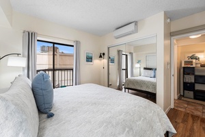 Unwind in your peaceful bedroom with soft linens, city views, and climate-controlled comfort for the perfect night's rest.