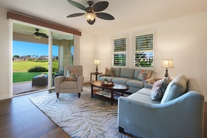 Relax in your elegantly furnished living room, where tropical ceiling fans keep you cool and sliding doors open to stunning golf course views.