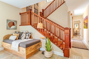 Elegant staircase connects the ground level with the upper level.