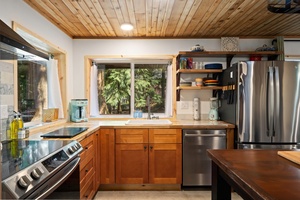 Natural light fills the kitchen from every angle, creating a peaceful and functional place to cook.