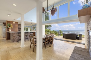 Dining area with a disappearing wall of pocket doors