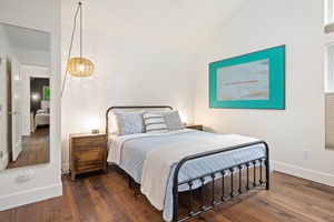 The Baker Suite has a queen bed, cheerful colors, and a cozy vibe.