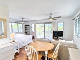 The guest cottage offers a king bed, pull-out memory foam sofa bed, and new split air conditioning for a restful retreat.
