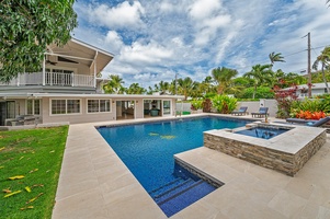 Lush backyard with large pool deck and pool give you all the feels of having your own private mini hotel!  (Note: Upper pool area is apart of the pool and NOT a spa)