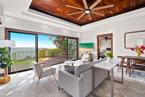 Inviting living space with sleek decor and tropical garden views.