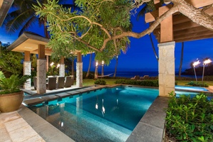 As evening falls, the illuminated pool offers a serene setting for a refreshing swim beneath the stars.