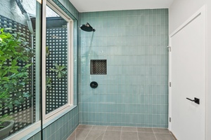 Downstairs bathroom with beautiful glass shower.