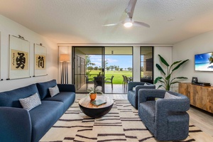 Gaze out at the golf course and distant ocean while lounging in the living room—your private window to paradise.