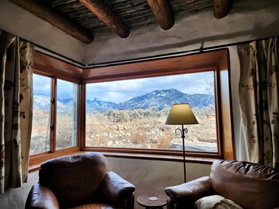 Big picture windows with a mountain view in the living area