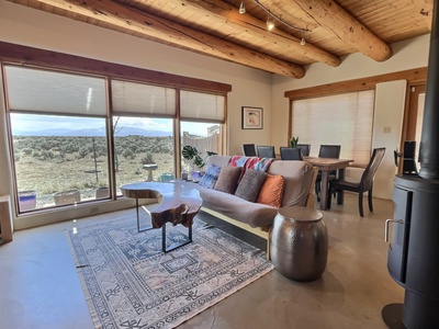 An open living and dining room with mesa views