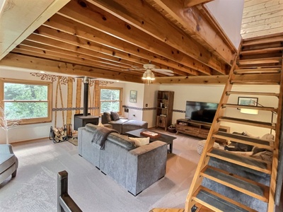 Spacious Living Area With Wood Burning Stove